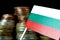 Bulgarian flag waving with stack of money coins