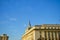 Bulgarian flags on government buildings in sofia during sunny day.