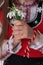 Bulgarian girl in traditional folklore costumes with spring flower bouquet snowdrops, Bulgaria martenitsa Baba Marta