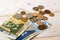 Bulgarian lev banknotes and coins on a white wooden surface. Bulgarian paper and metal money on a table. Wealth, poverty and money