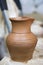 Bulgarian master ceramist with 13 years of experience made jug from red clay on a potter`s wheel