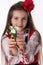 Bulgarian woman with bouquet spring snowdrop flowers and martenitsa March holiday Baba Marta, Bulgaria