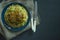 Bulgur with cutlet and vegetables served on a plate. Pork cutlets with porridge. Proper nutrition. Dark background. View from