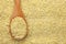 Bulgur wheat in a wooden spoon