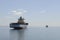 Bulk Cargo Ship Stranded, Low Tide, Ferry Boat Background