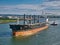 The bulk carrier Cabrera leaving Belfast Harbour in June 2021 on a clear, sunny evening in June 2021.