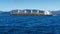 Bulk carrier loaded with pine tree logs, leaving the Marlborough Sounds, New Zealand