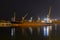 Bulk carrier vessel moored alongside berth in port. Night view. Bulker. Dry cargo ship