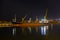 Bulk carrier vessel moored alongside berth in port. Night view. Bulker. Dry cargo ship