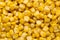 Bulk of yellow corn grains texture.