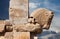 Bull Figure from Achaemenid Dynasty as a Column Capital in Persepolis of Iran Against Cloudy Blue Sky