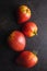 Bull heart tomatoes on black table