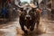 a bull running through a muddy street with people in the background