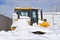 Bulldozer buried in the deep snow