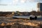 Bulldozer during construction of main water supply pipelin and natural gas. Laying underground storm sewers at construction site.