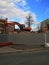 Bulldozer crushing the building at construction site