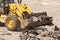 Bulldozer Dismantles Asphalt at Work