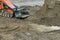 Bulldozer earthmoving dozer is moving soil is leveling the land