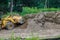 Bulldozer earthmoving on the leveling moving soil landscaping works