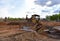 Bulldozer at landfill for work concrete demolition waste. Dozer at construction site during land clearing, grading, pool