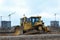 Bulldozer during of large construction jobs at building site.  Crawler tractor dozer for earth-moving