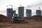 Bulldozer during of large construction jobs at building site. Crawler tractor dozer for earth-moving.