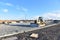 Bulldozer moves gravel during on road work at construction site. Dozer leveling stones for laying asphalt on a new freeway. Heavy