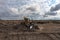 Bulldozer moving waste on a landfill site