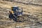 Bulldozer push dirt in excavation pit