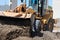 Bulldozer Pushing Dirt at Construction Site