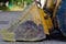 Bulldozer scoop, closeup side view. scratched yellow bulldozer bucket