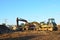 Bulldozer Shantui SD16 and Group Excavators brands of the Kraneks and CATERPILLAR with buckets