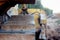 Bulldozer stands on the sand near the forest. close-up of a metal track of a bulldozer. laying a new road along the forest