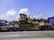 Bulldozer on truck in traffic