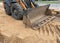 Bulldozer working on sand in the Construction Site. Wheel loader at work.