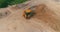 Bulldozer works at a construction site. Workflow on the line. Bulldozer construction site aerial view