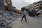 Bulldozers remove the debris from the  building, that was hit by Israeli air strikes during the Israeli-Palestinian conflict in Ma