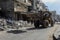 Bulldozers remove the debris from the  building, that was hit by Israeli air strikes during the Israeli-Palestinian conflict in Ma