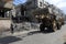 Bulldozers remove the debris from the  building, that was hit by Israeli air strikes during the Israeli-Palestinian conflict in Ma