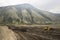 Bulldozers remove the top layer of mountain soil.