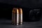 Bullet 9mm. On the dark stone table.rounds and military technology