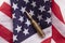 Bullet ammunition on a United states stars and stripes flag