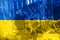 Bullet hole, cracks in the glass on a yellow-blue background. Ukraine flag on broken glass texture. Concept, Russian-Ukrainian war