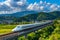 Bullet train speeding through countryside wide shot. Generative AI Illustration.