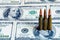 Bullets and banknotes as an abstract symbol of the causes of mil
