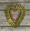 Bullets in the shape of heart on rustic wooden background