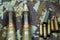 Bullets, shells, cartridges and projectiles on khaki camouflage backpack. Lend-Lease concept. Army concept. Sales of weapons and