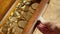 Bullion gold coins in a closing drawer.