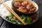 Bun cha Hanoi is a delicious Vietnamese street food combining flavorful meatballs, rice noodles and dipping sauce. Horizontal