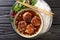 Bun cha Hanoi is a delicious Vietnamese street food combining flavorful meatballs, rice noodles and dipping sauce. Horizontal top